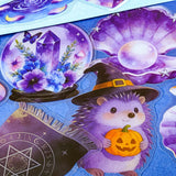 pack of 50 magical fantasy stickers featuring crystal balls, spell books, moonlit scrolls, enchanted mushrooms, ravens, potion bottles, celestial moons, magical animals and crystal gardens in lavender, violet and blue tones. UK stationery shop and letterbox gifts store.