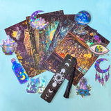 moon witch gift set with illustrated pouch, magical postcards, holographic stickers and celestial bookmark on blue background