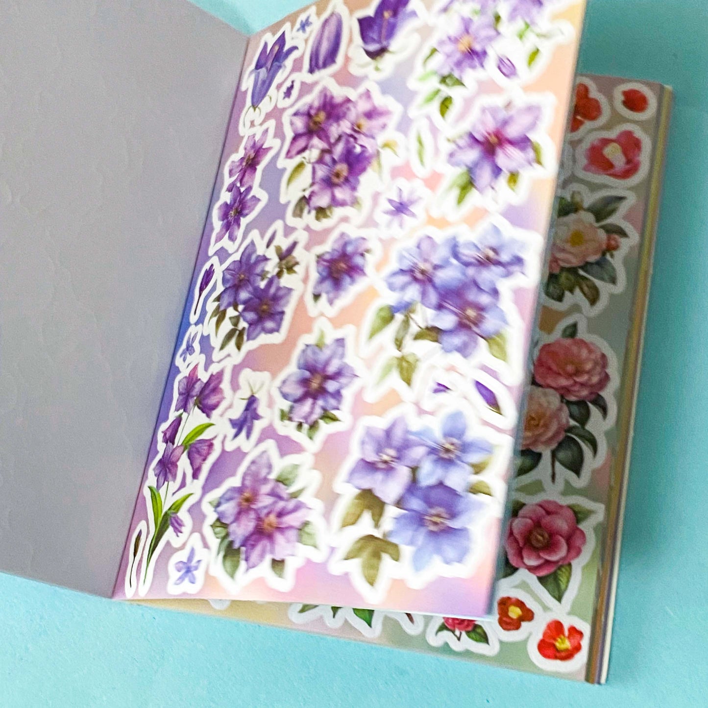 31 page floral sticker book on a blue background