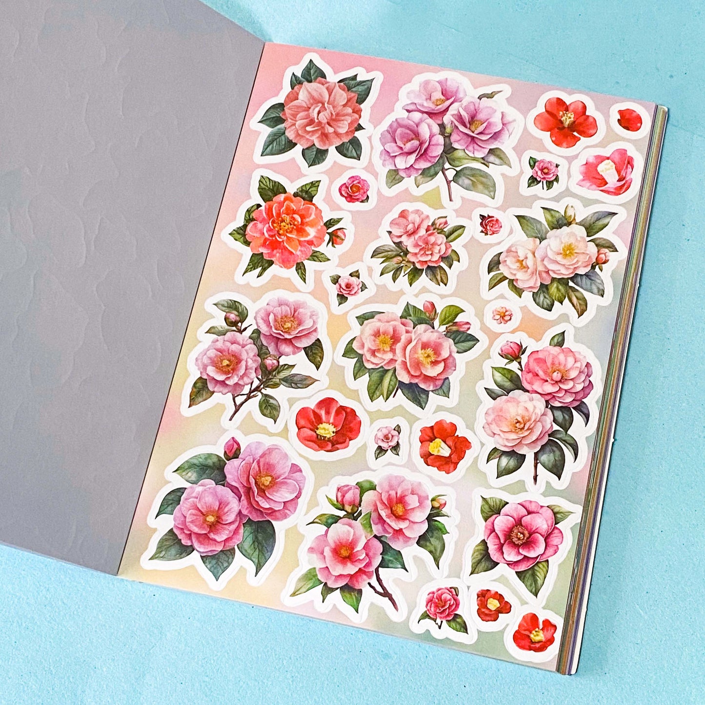 31 page floral sticker book on a blue background