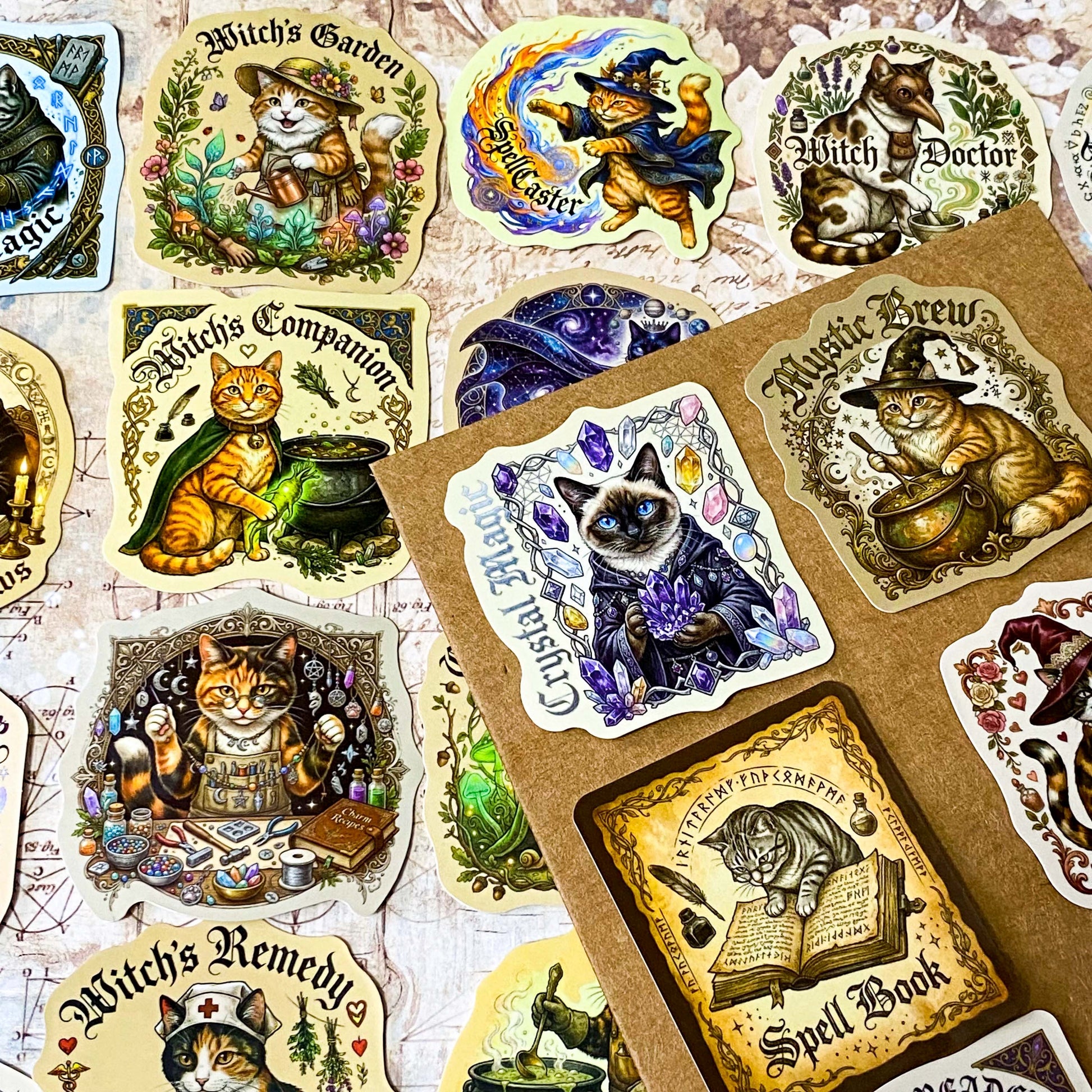 Collection of 50 witch-themed glossy laptop stickers with cats and magical elements on a textured surface. vintage sepia tone with designs including spell caster cat and witch doctor cat