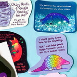 colourful glossy affirmation stickers with cute animals and positive mental health messages including  bear, pangolin and fantasy creatures on pastel background