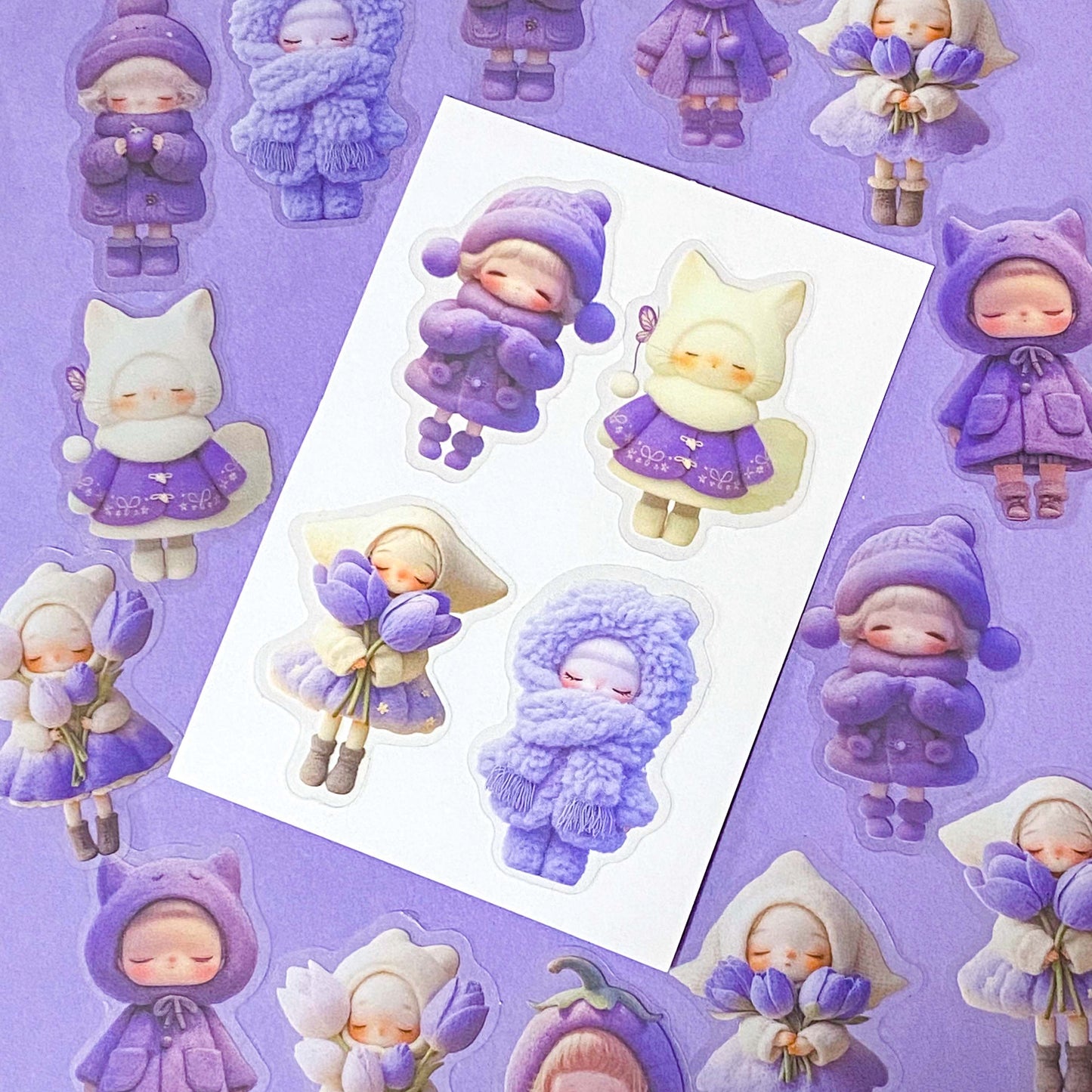 kawaii large PET lilac and purple doll stickers set of 20 with big colourful figures wearing winter clothing and holding spring flowers. Tulips, wooly hats and cat costumes. Cute stationery shop uk.