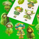 edible vegetables cute green large PET doll stickers with adorable costumes of peas, broccoli, lily of the valley, clover and winter cosy clothing outfits. Vibrant sticker pack of 20. Uk small stationery business.