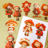 bright vibrant red doll stickers pack of 20 with colourful girls in cute outfits. Designs include a mushroom, poppies, flower petals and winter cosy outfits. uk stationery shop for kawaii gifts.