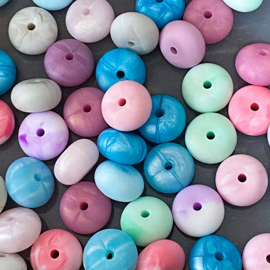 silicone spacer beads with a chunky shape and  marble and pearl finish in pink, blue, mint, rose, metallic blue and purple.