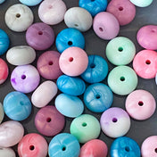 silicone spacer beads with a chunky shape and  marble and pearl finish in pink, blue, mint, rose, metallic blue and purple.
