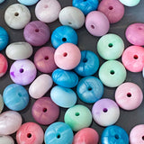 silicone spacer beads with a chunky shape and  marble and pearl finish in pink, blue, mint, rose, metallic blue and purple.