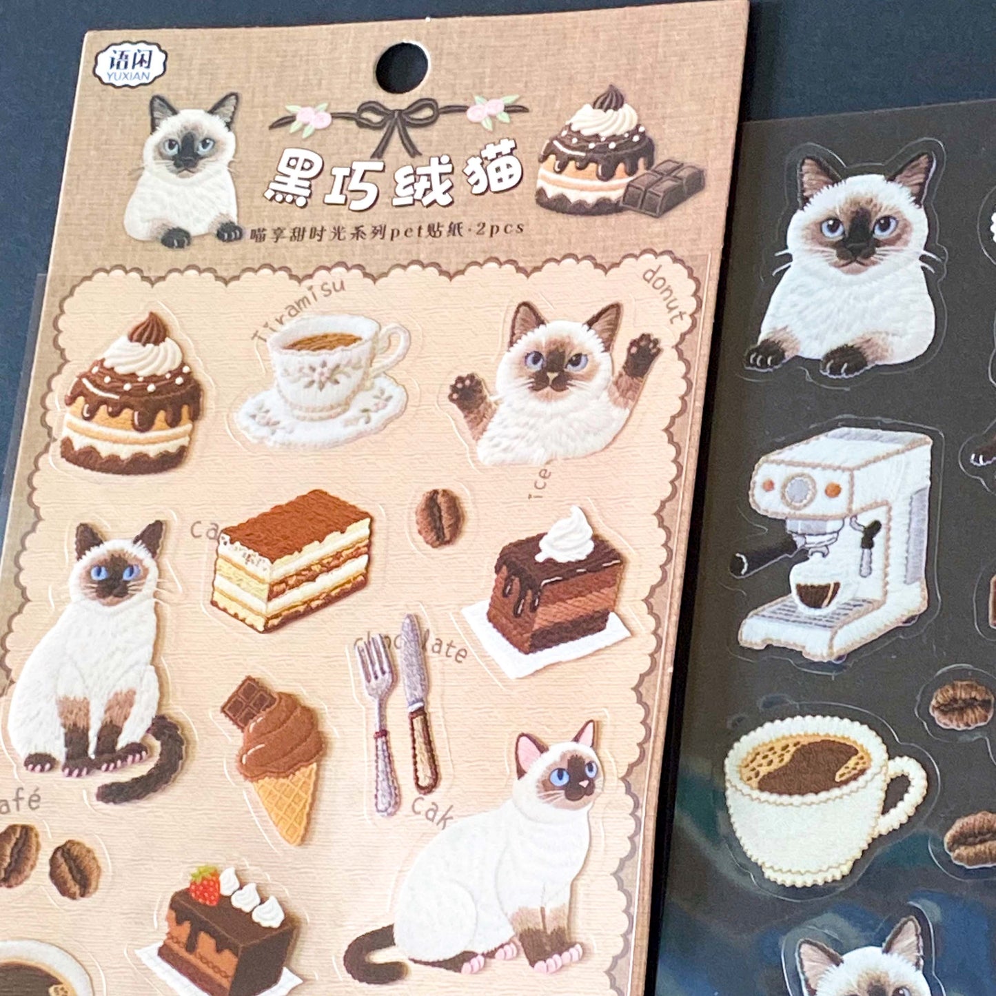 sticker sheets with clear PET cats and cafe food and drinks including siamese cat, coffee, cake, ice cream and pastries in a café aesthetic for planner and journal supplies