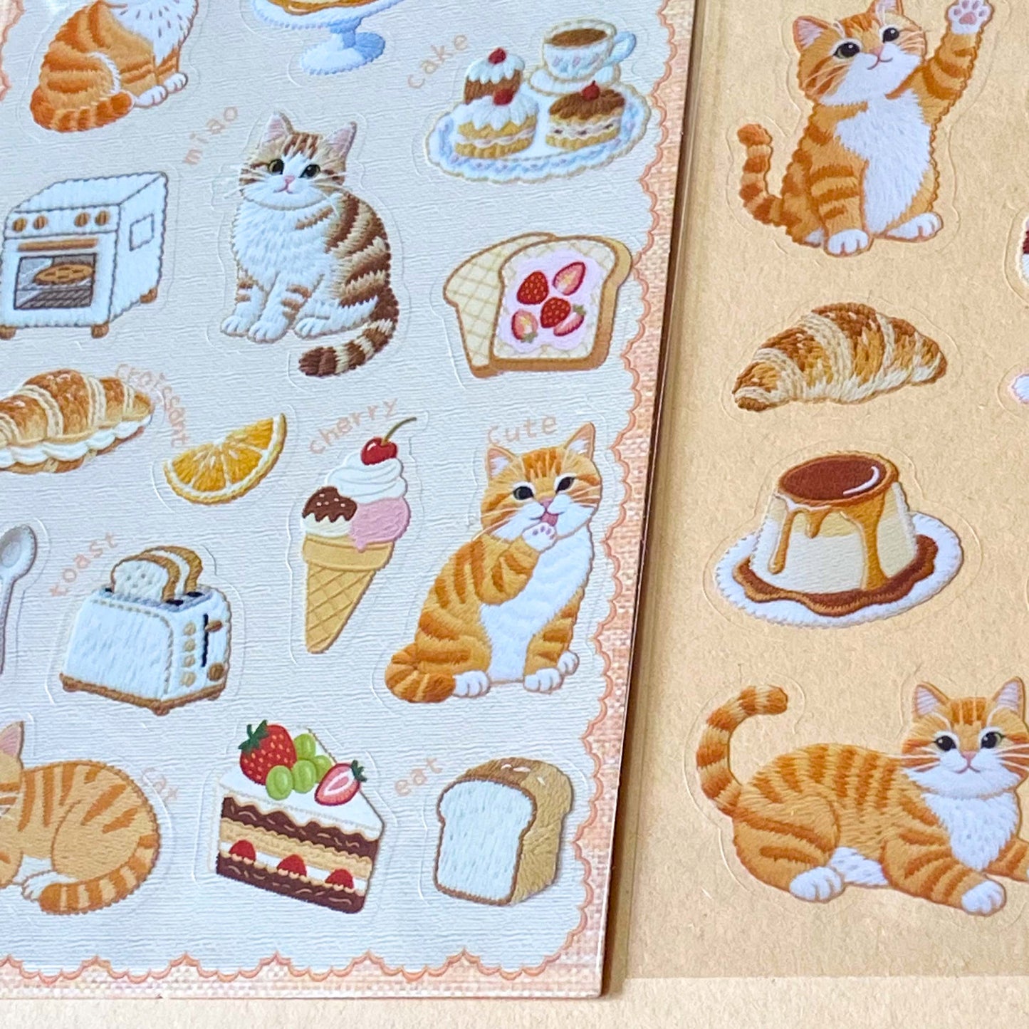 two assorted clear PET sticker sheets featuring ginger cats with bakery treats, pastries, cakes and cosy dessert illustrations. uk planner supplies shop
