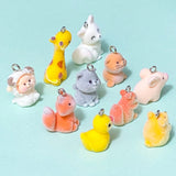 flocked furry fuzzy animal animals charm charms resin soft fluffy cute kawaii pendant pendants uk squirrel squirrels cat cats grey brown orange yellow duck ducks pig pigs seal seals giraffe giraffes ram sheep lamb guinea pig hamster gerbil fox foxes white silver tone metal hook