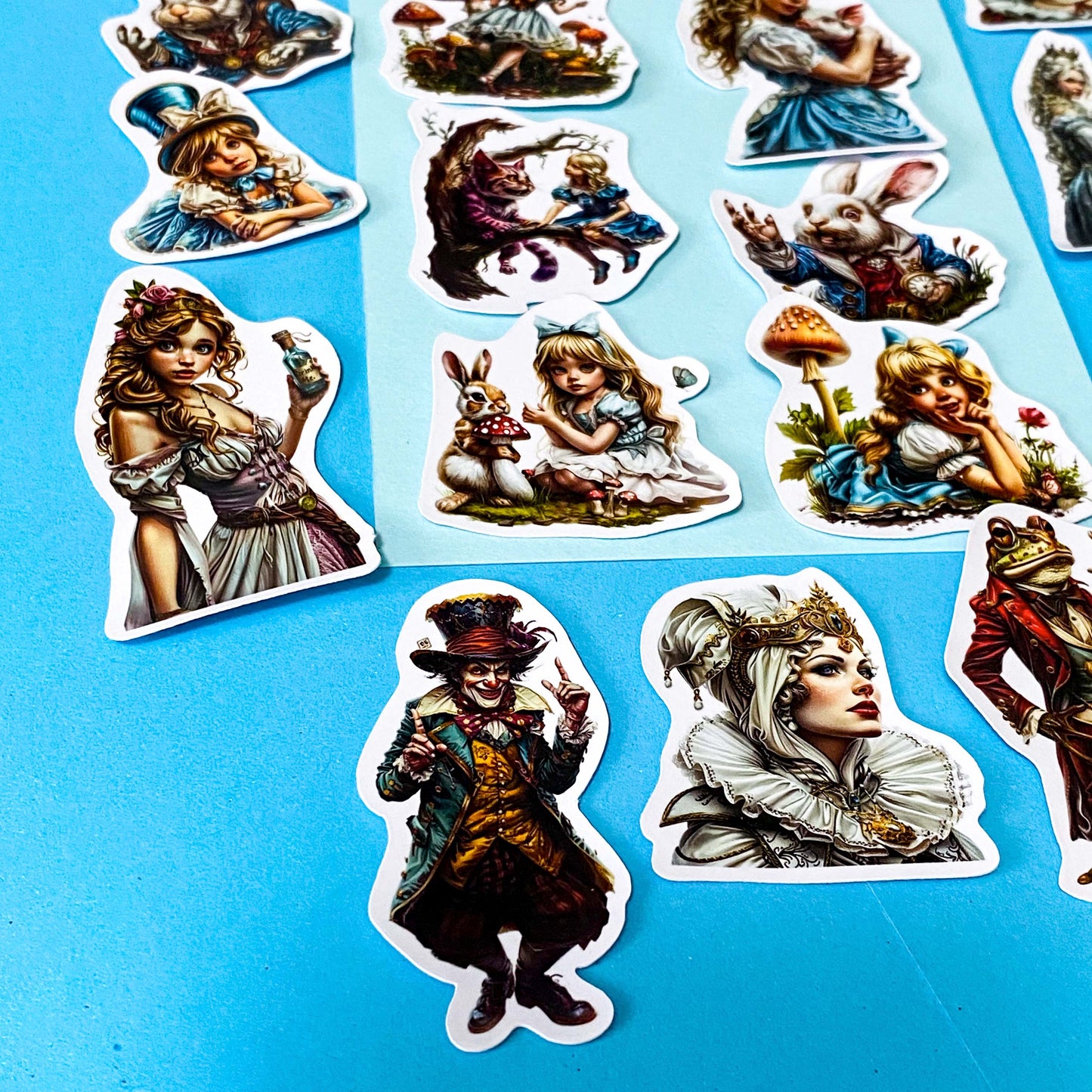 alice in wonderland inspired alternative twisted, dark vinyl sticker set of 20, satin finish, featuring the mad hatter, the red queen, alice, the white rabbit, mushrooms, and a frog footman. UK cute sticker shop.