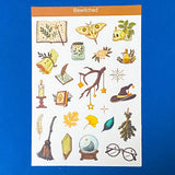 Sheet of witch-themed stickers with various symbols on a blue background