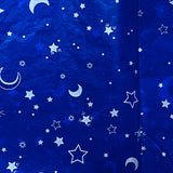 deep rich blue tissue paper sheets with silver stars and moons in a celestial theme. pretty packaging supplies uk. star and moon design gift wrap.