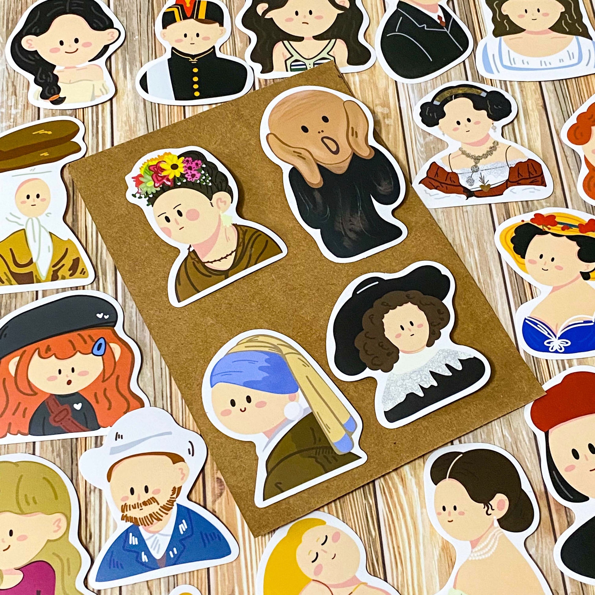 fifty different kawaii portrait art stickers inspired by famous artists, masterpieces and historical figures with matte finish, each measuring up to 70mm tall. designs include mona lisa, the scream, birth of venus, frieda kahlo, matisse, van gogh