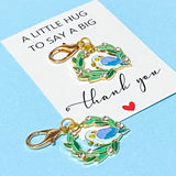 blue bird and wreath enamel and gold metal keyring clip gift with the words thank you to say a big hug