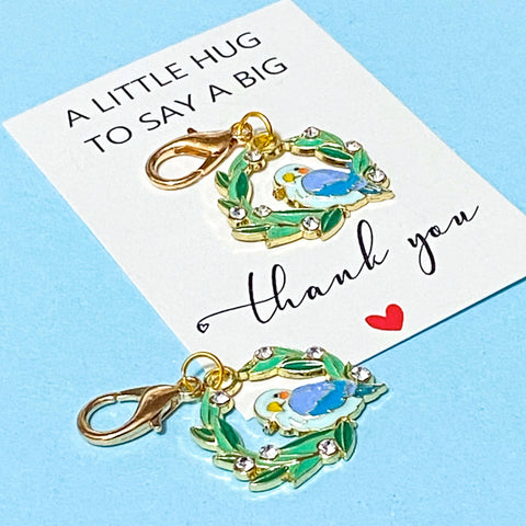 blue bird and wreath enamel and gold metal keyring clip gift with the words thank you to say a big hug