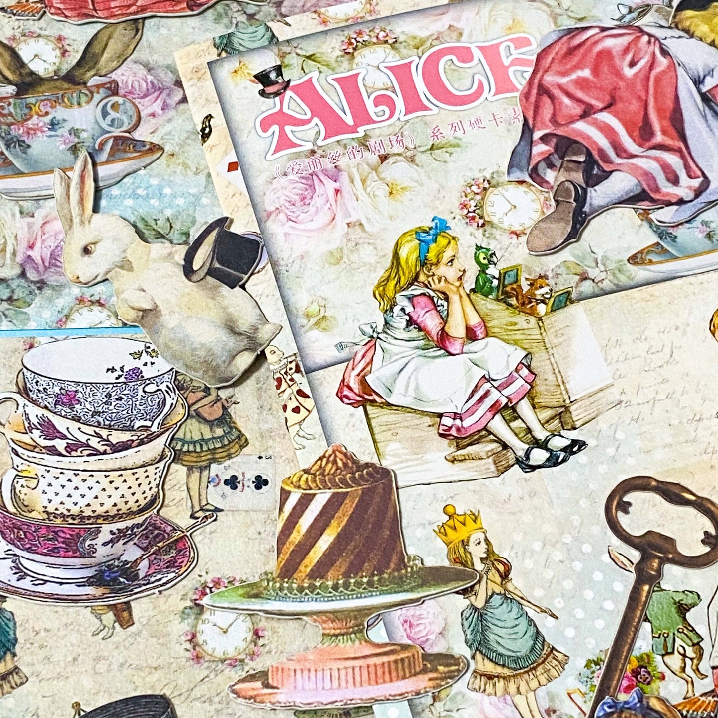 vintage alice in wonderland paper ephemera with floral backgrounds and character illustrations for journalling