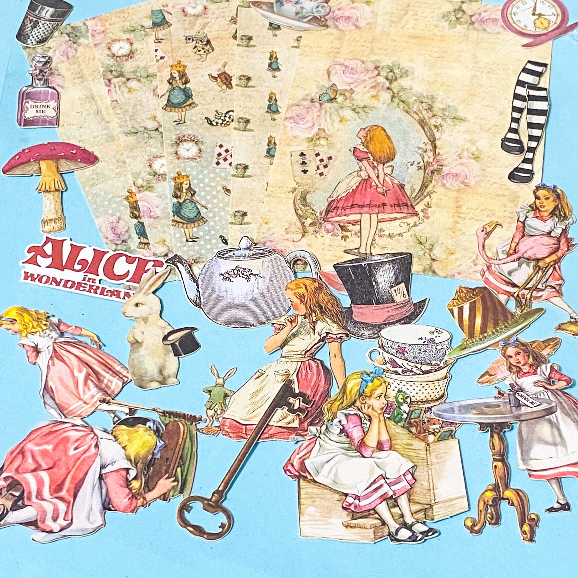 alice in wonderland ephemera pack with vintage paper sheets and die cut illustrations on blue background