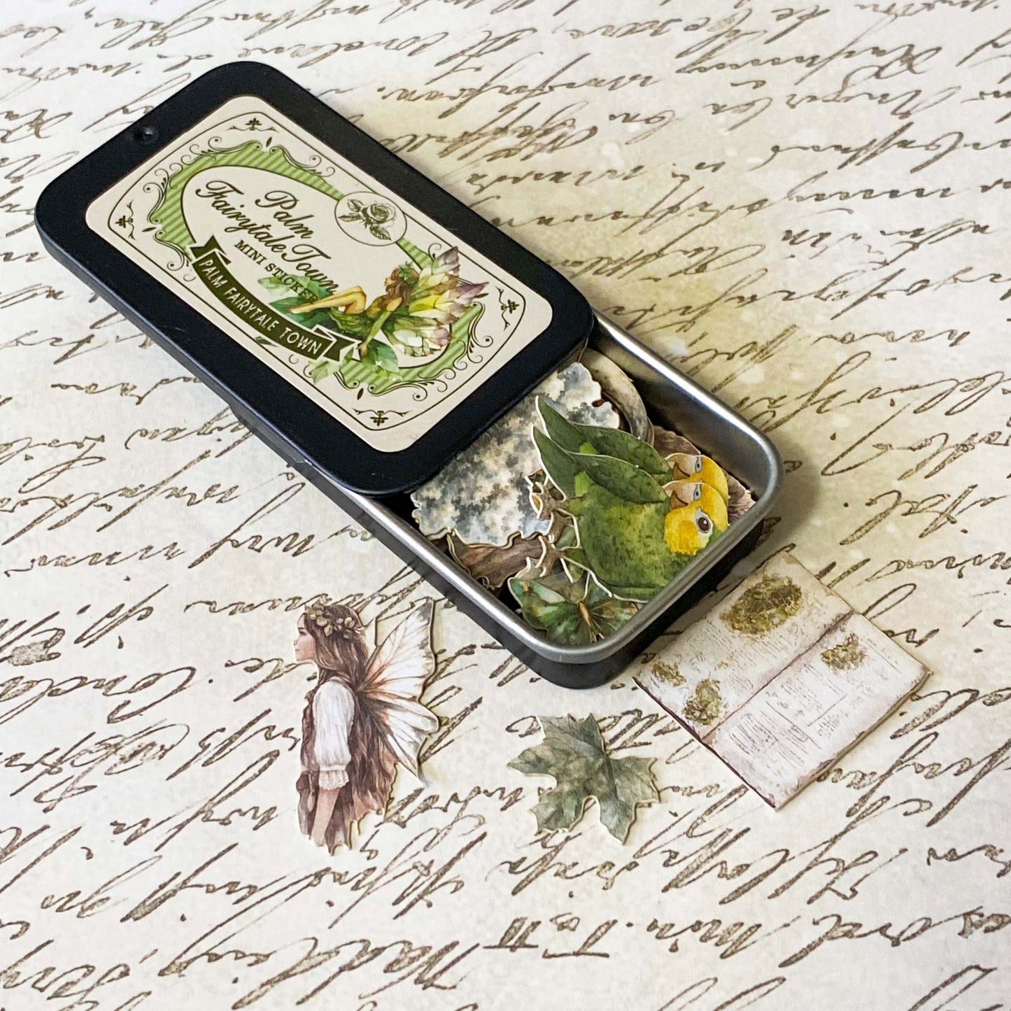 mini tin of 60 card stickers in an enchanted forest theme with mushrooms, berries, birds, books, butterflies, tree stumps and diamond rings