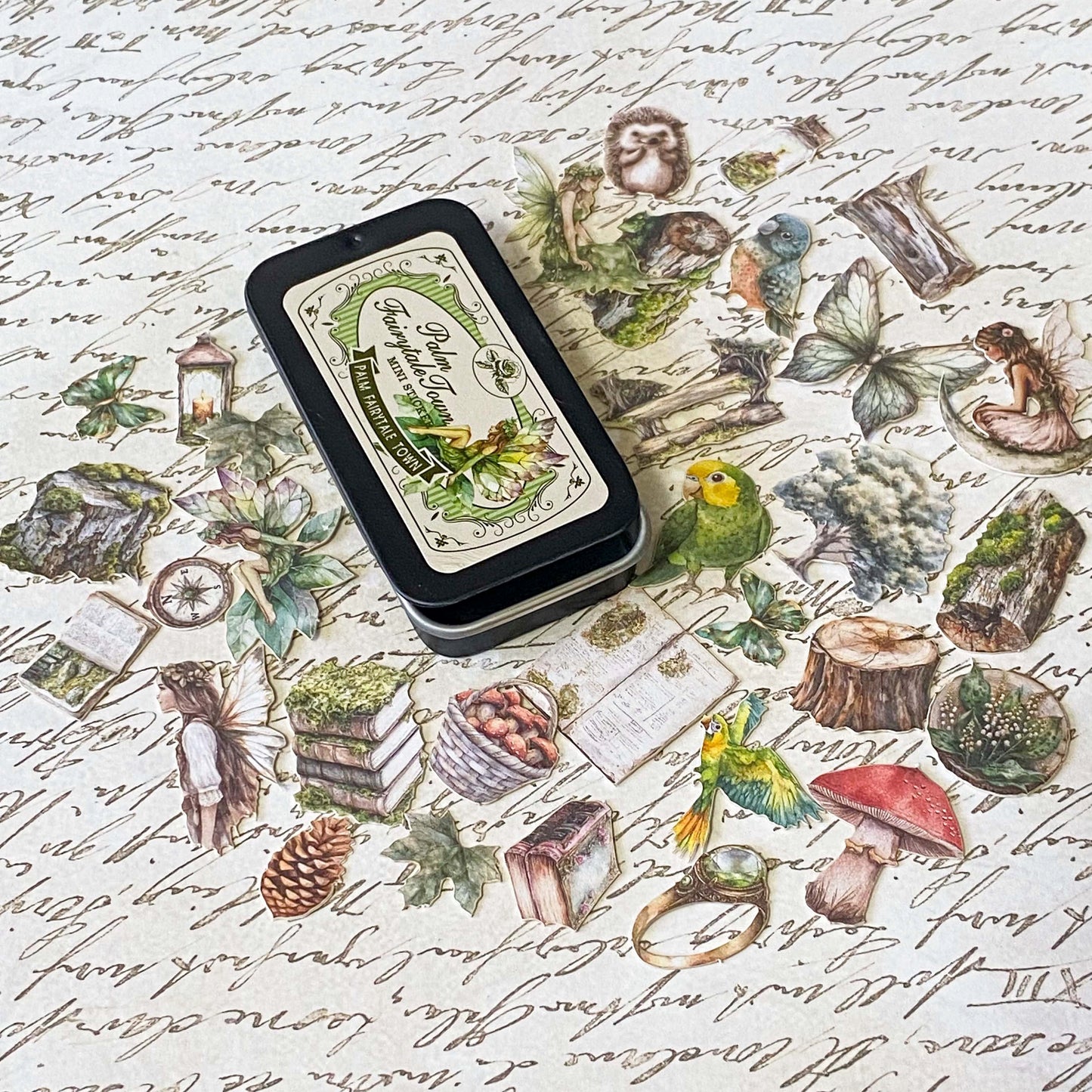 mini tin of 60 card stickers in an enchanted forest theme with mushrooms, berries, birds, books, butterflies, tree stumps and diamond rings