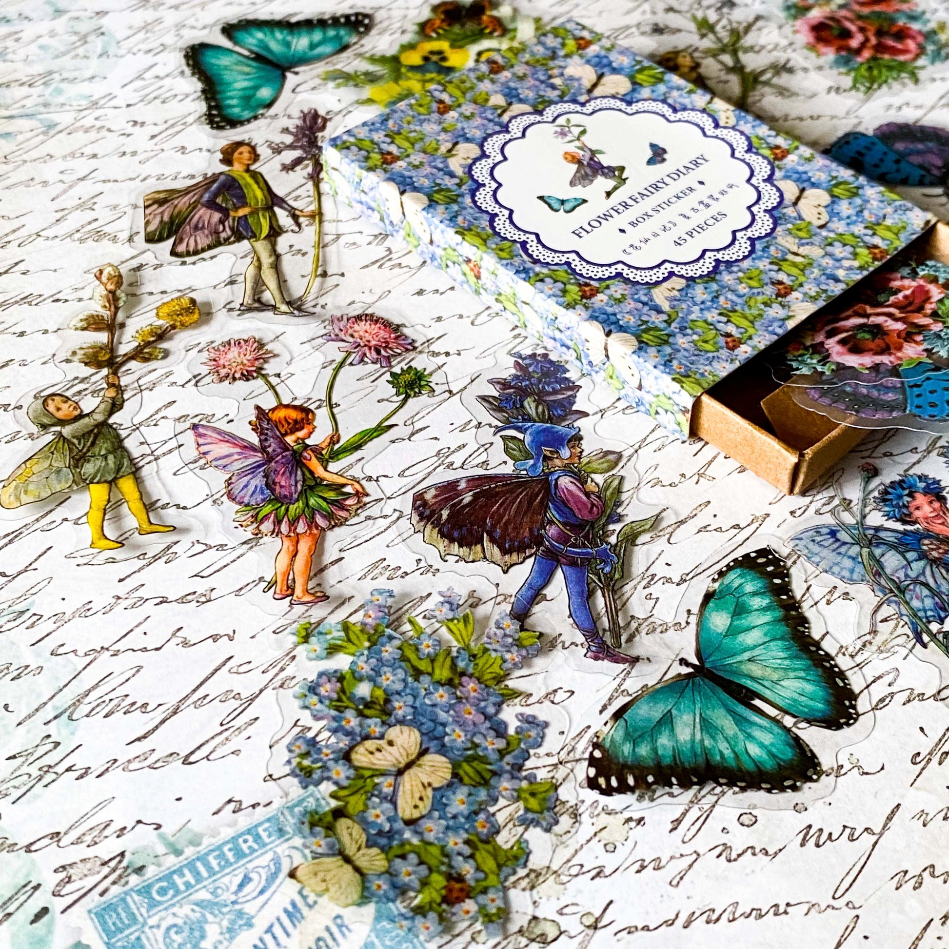 flower fairy clear sticker box with vintage botanical fairies transparent stickers set in blue box, blue violet and turquoise green flowers and butterflies