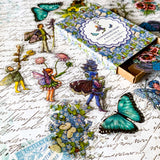 flower fairy clear sticker box with vintage botanical fairies transparent stickers set in blue box, blue violet and turquoise green flowers and butterflies