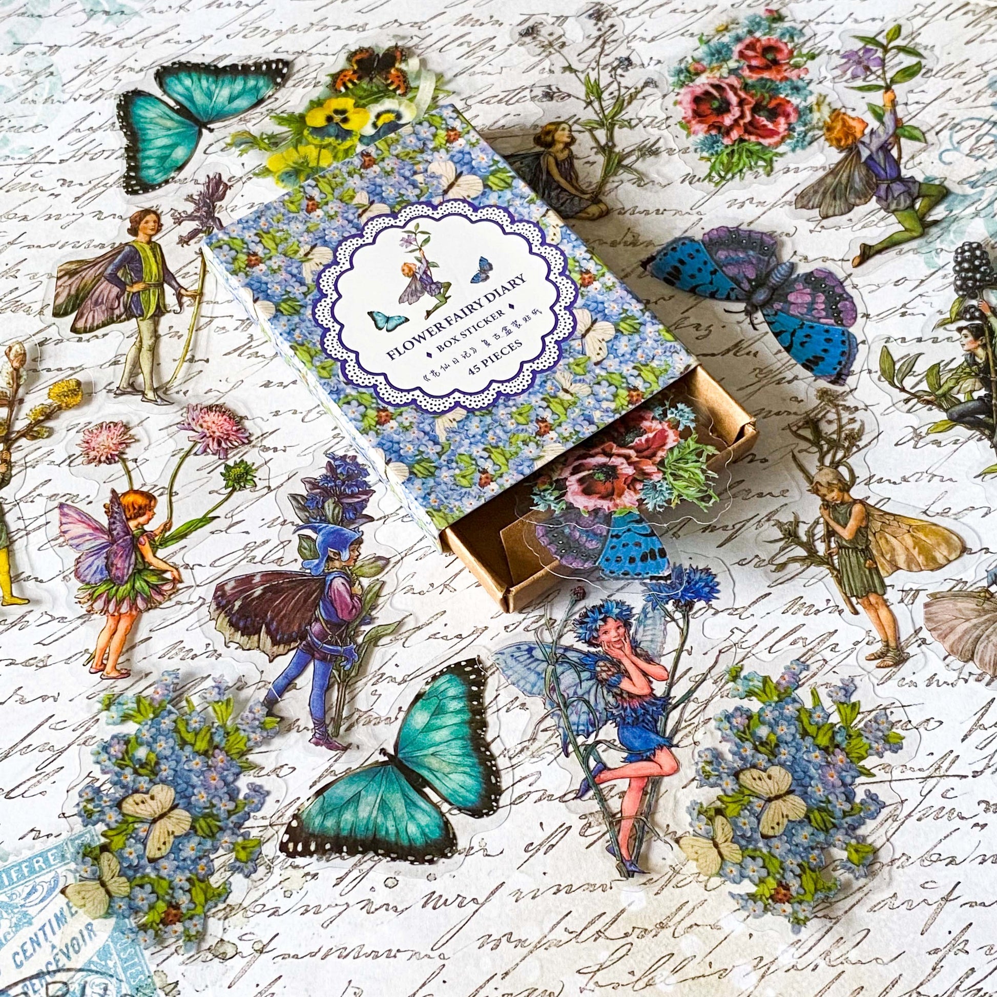 flower fairy clear sticker box with vintage botanical fairies transparent stickers set in blue box, blue violet and turquoise green flowers and butterflies