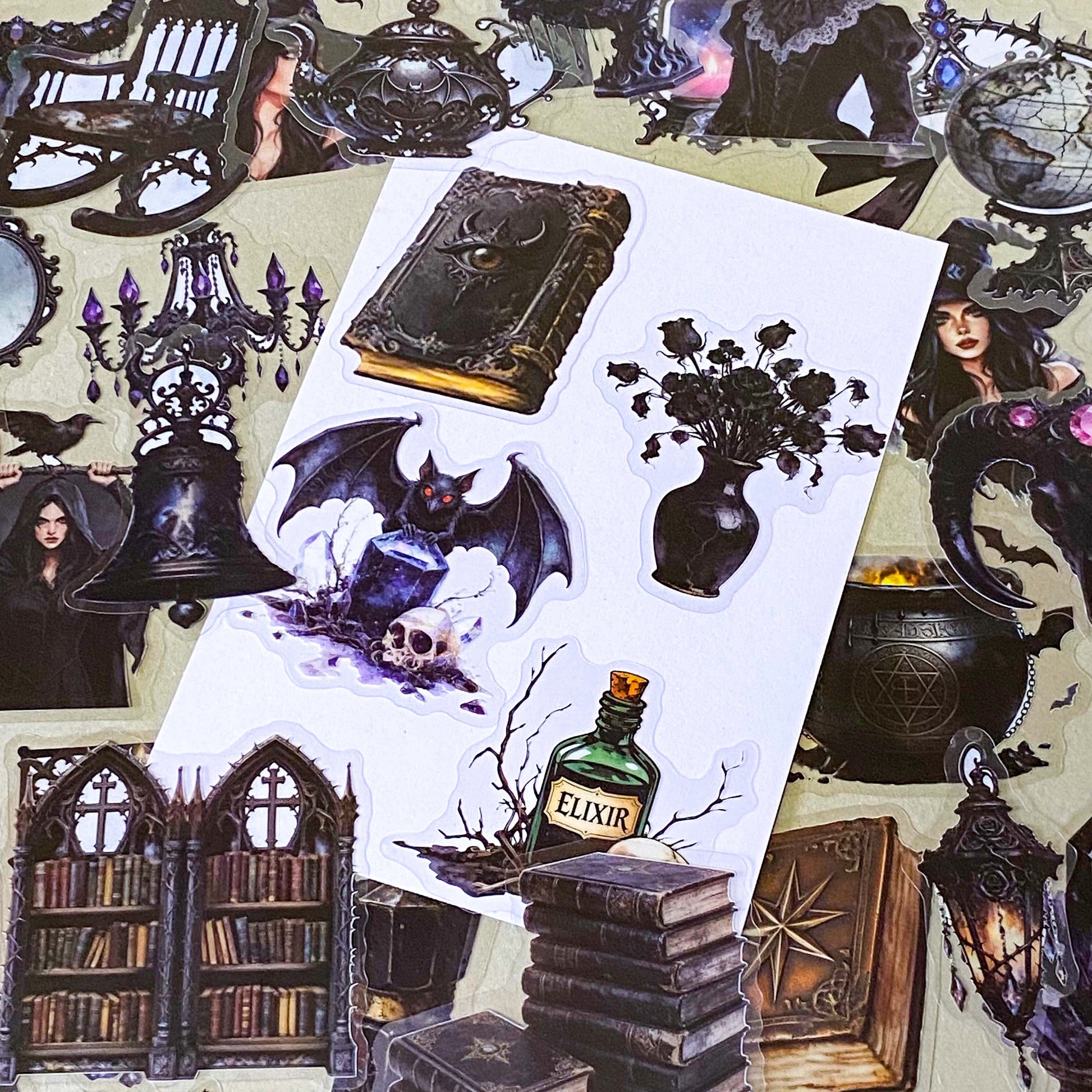 pack of 50 gothic PET stickers featuring ravens, dragons, black cats, antique books, potion bottles, crystals, witches, bats and dark academia stickers. black aesthetic. uk stationery shop.