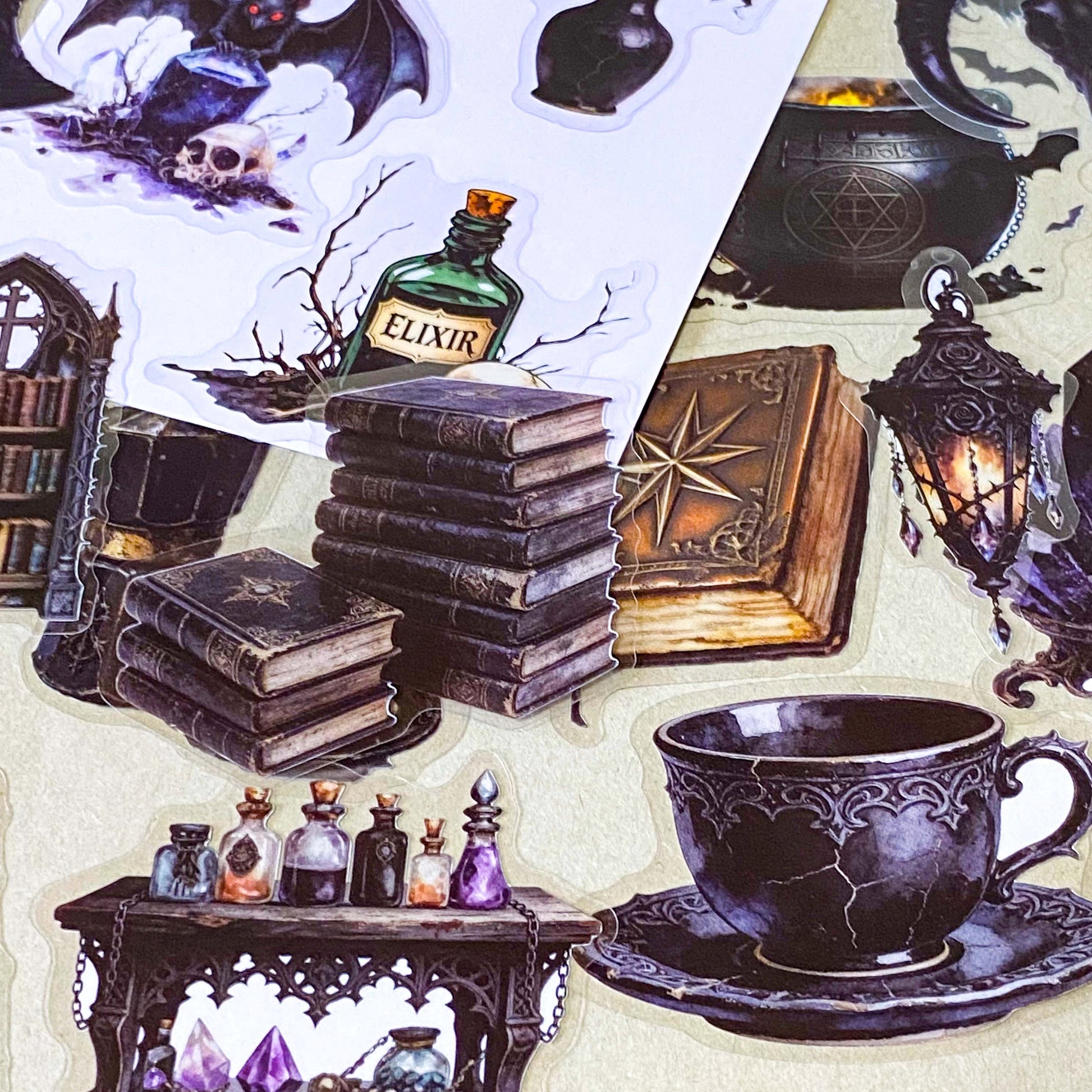 pack of 50 gothic PET stickers featuring ravens, dragons, black cats, antique books, potion bottles, crystals, witches, bats and dark academia stickers. black aesthetic. uk stationery shop.