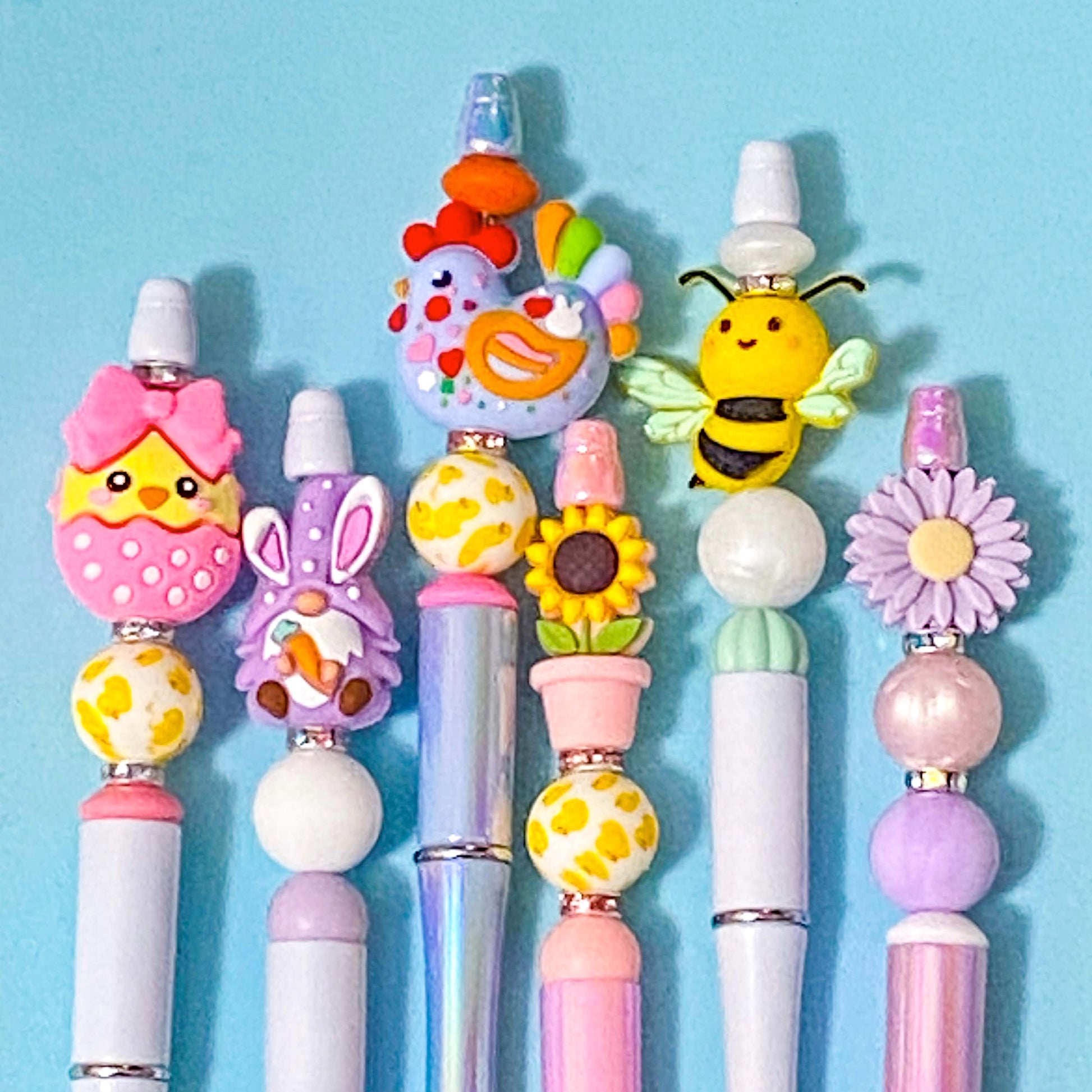 spring and easter beaded pens n pale blue background