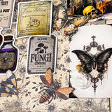 witchy apothecary ephemera bundle with potion vial, vintage herb cards, gothic stickers, insect illustrations and scrapbook papers arranged on botanical background