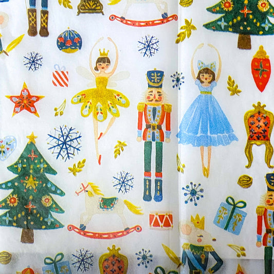 nutcracker suite christmas tissue paper wrap with clara, the sugar plum fairy, toys and the mouse king on a white background.