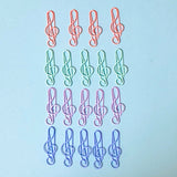 Colourful treble clef musical paper clips arranged in a grid on a light blue background