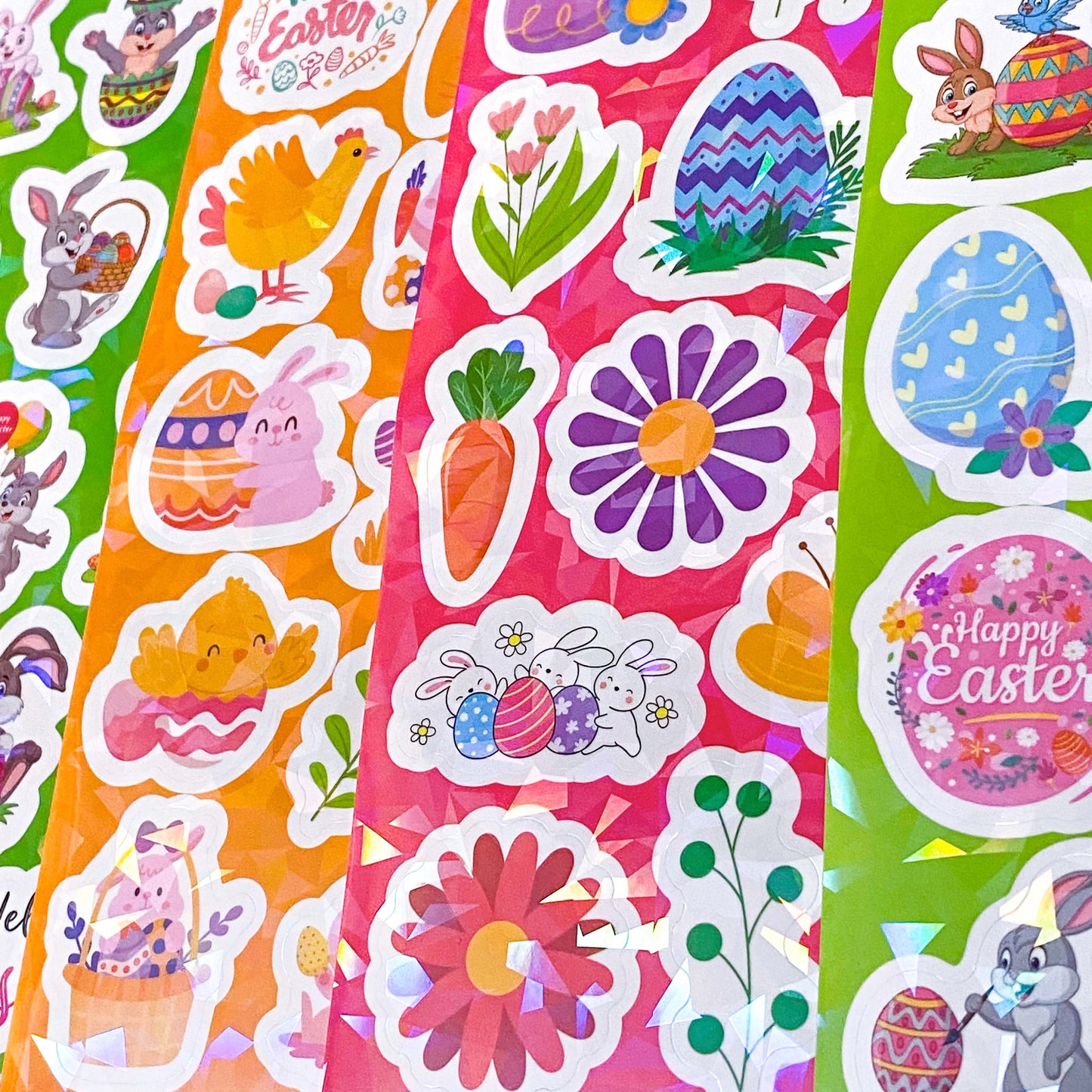 Colorful Easter-themed stickers with flowers, bunnies, and eggs on a pink background.
