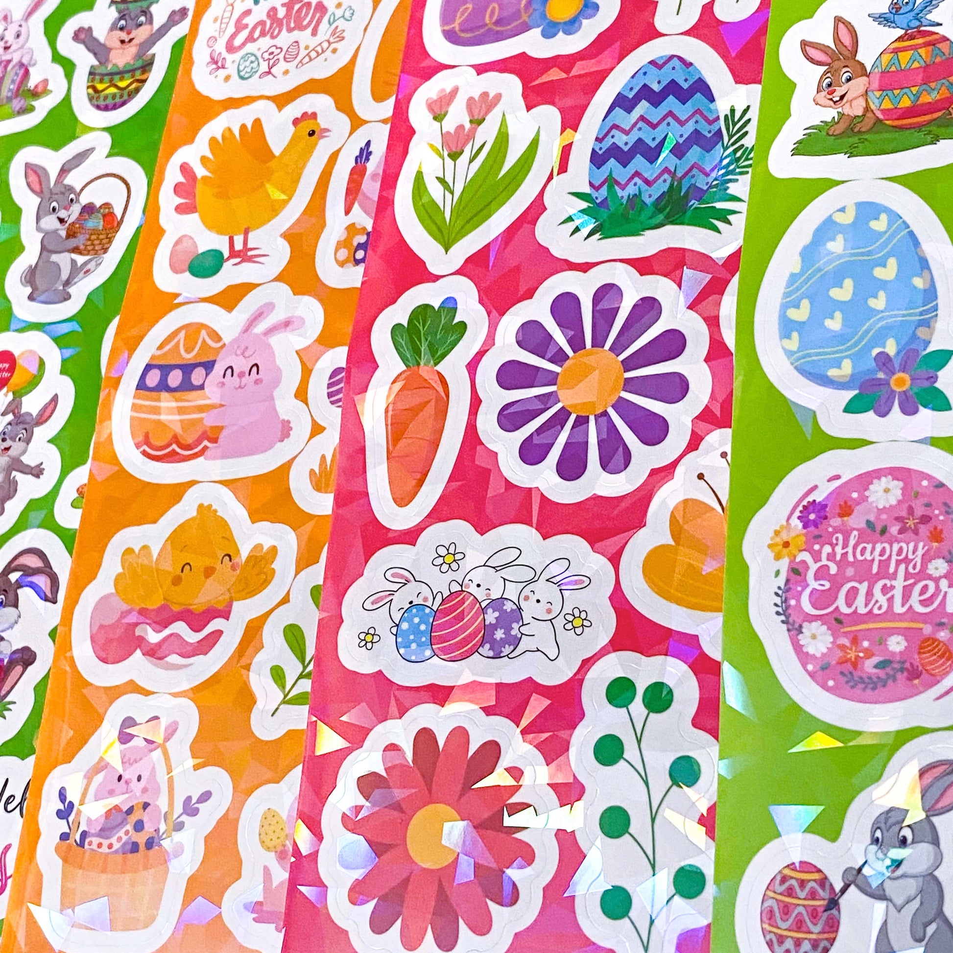 Colorful Easter-themed stickers with flowers, bunnies, and eggs on a pink background.
