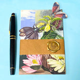 vintage botanical Kew Gardens postcard bundle wrapped in kraft belly band with wax seal sticker with insect die cuts and floral stickers ephemera