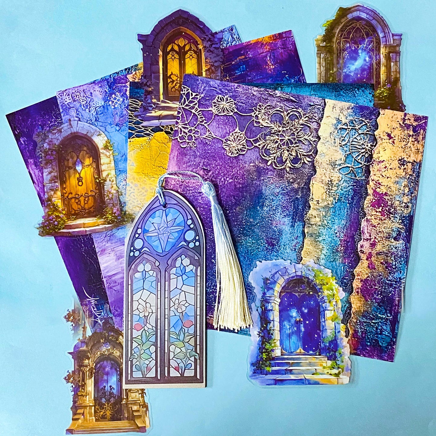 stained glass acrylic bookmark with tassel and decorative journal papers and clear door stickers on a blue background