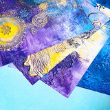 close up of ornate scrapbook papers in blue, purple and gold with ornate patterns