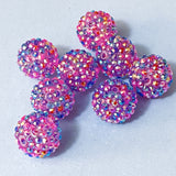 pink and purple pave sparkly 20mm beads on a blue background