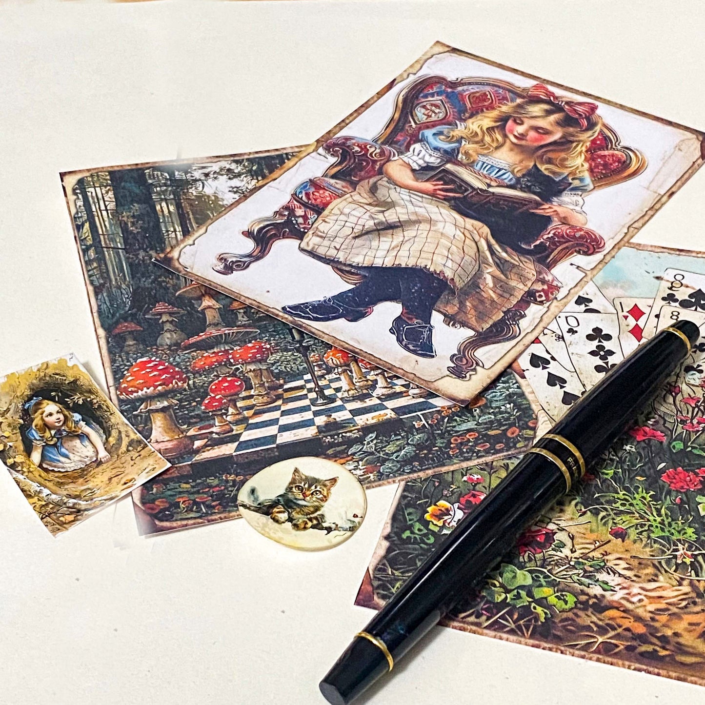 close up of vintage style scrapbook paper designs featuring alice, woodland scene and mushrooms, plus storybook stickers