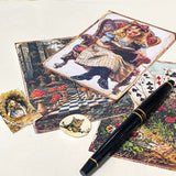 close up of vintage style scrapbook paper designs featuring alice, woodland scene and mushrooms, plus storybook stickers