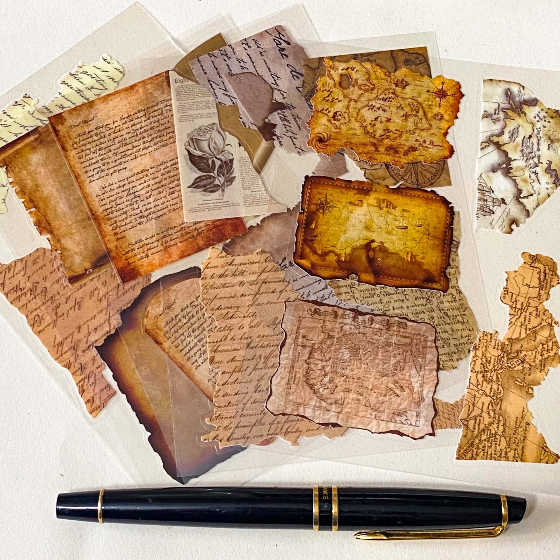 set of large clear sticker sheets of faded and antique paper, maps and letters