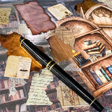 vintage library journaling kit with scrapbook paper, clear stickers, paper ephemera and bookshelf card pieces arranged with black pen on book background