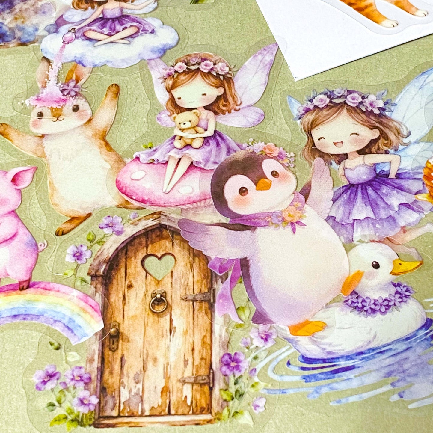 collection of 50 different pastel storybook stickers featuring fairies, woodland animals, flowers, castles, moons and butterflies and enchanted cottagecore illustrations in soft lilac and lavender tones.