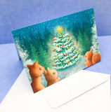 greeting greetings card cards christmas festive uk handmade kawaii cute stationery hand made forest wood woodland fir tree tree cute animals deer squirrel rabbit blue turquoise pretty colours illustrations artist art brown traditional