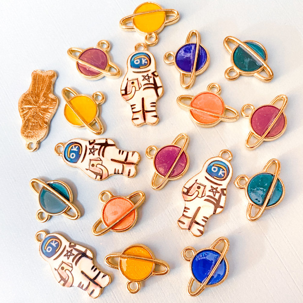spaceman space spacemen astronaut planet planets galaxy enamel charm charms gold tone metal rings pink blue green yellow peach uk cute kawaii craft supplies