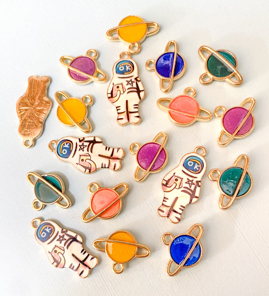 spaceman space spacemen astronaut planet planets galaxy enamel charm charms gold tone metal rings pink blue green yellow peach uk cute kawaii craft supplies