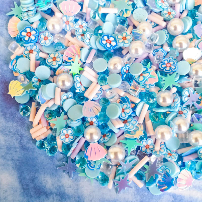 mermaid theme blue white turquoise pearl sprinkles mini decoden flatback fb fbs flat back backs bundle uk cute kawaii craft supplies polymer clay flower flowers sequins stars shell shells gems gem pale pink